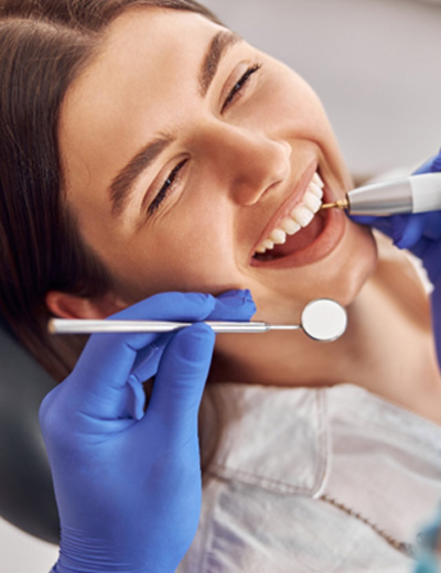 Woman having her teeth cleaned