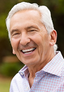smiling older man in plaid shirt