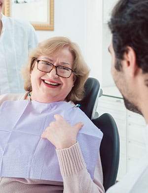 lady smiling with dental crowns in North Dallas