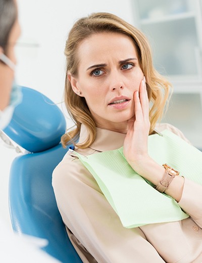 Woman visiting an emergency dentist in North Dallas