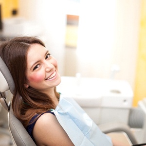 Implant dentist and patient discussing how to care for dental implants in North Dallas