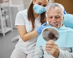 a dental implant patient smiling  