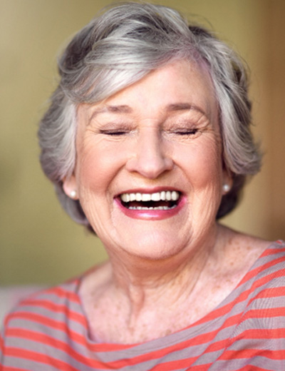 Laughing older woman with beautiful teeth