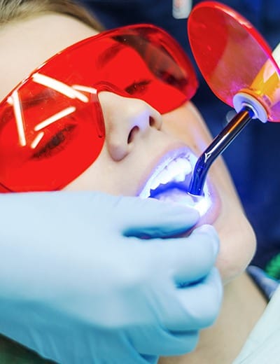 Patient receiving dental sealants