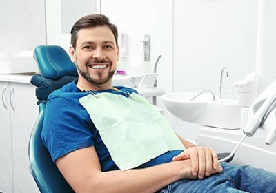 Smiling man in dental chair