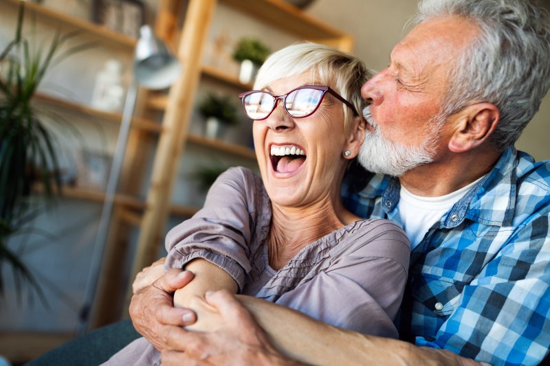 older couple hugging and laughing