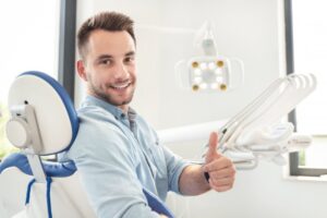 Man smiling after dental implant placement surgery